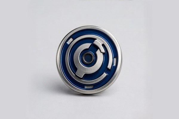 Custom spinner challenge coin showing center ball-bearing mechanism and concentric blue enamel rings